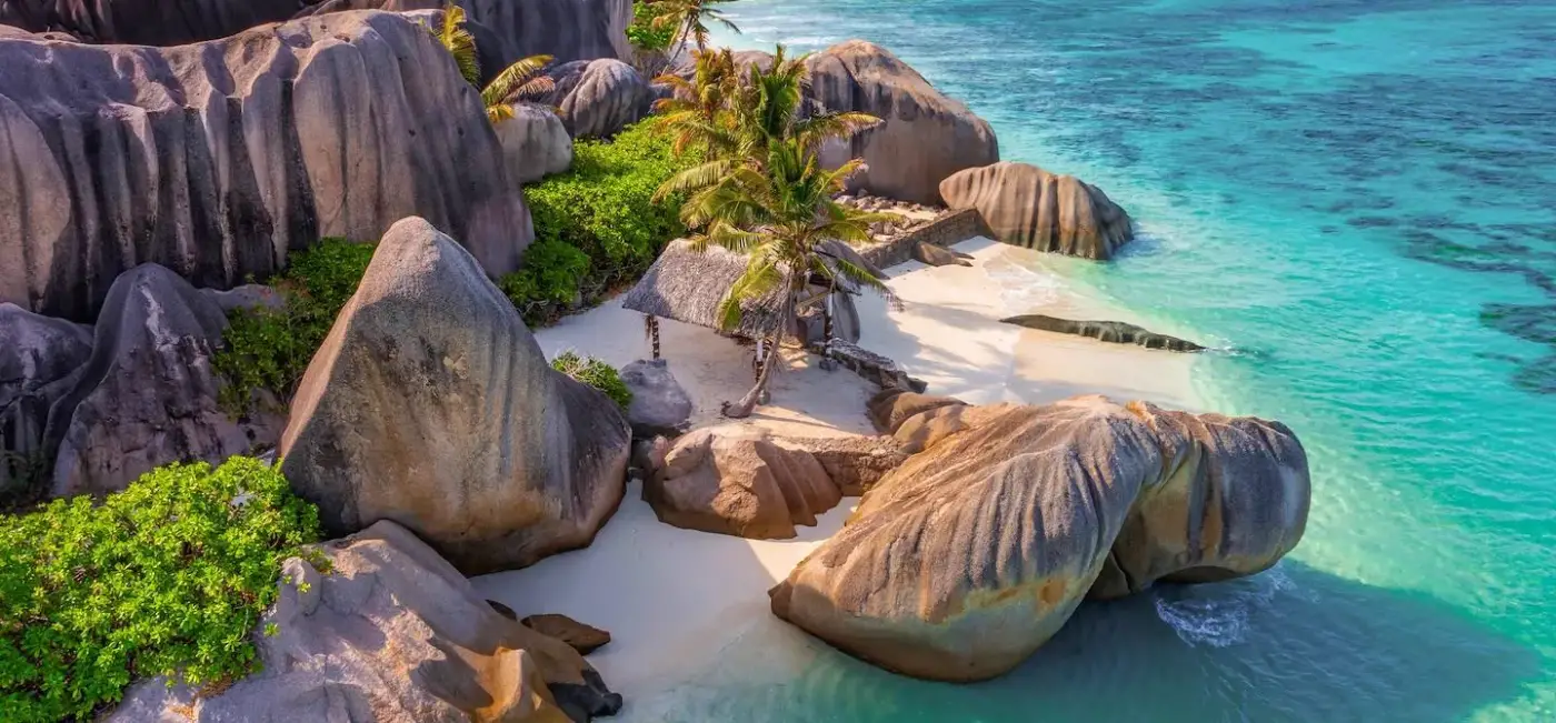 Anse Source d&rsquo;Argent on La Digue — granite boulders and shallow clear water